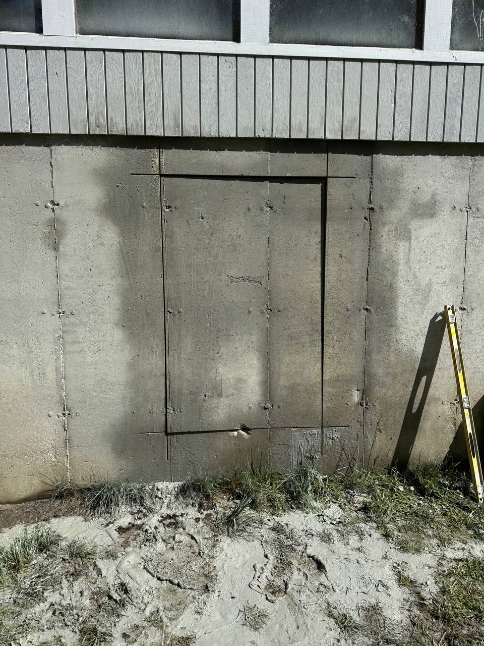 Precision wall cut for door opening in concrete foundation