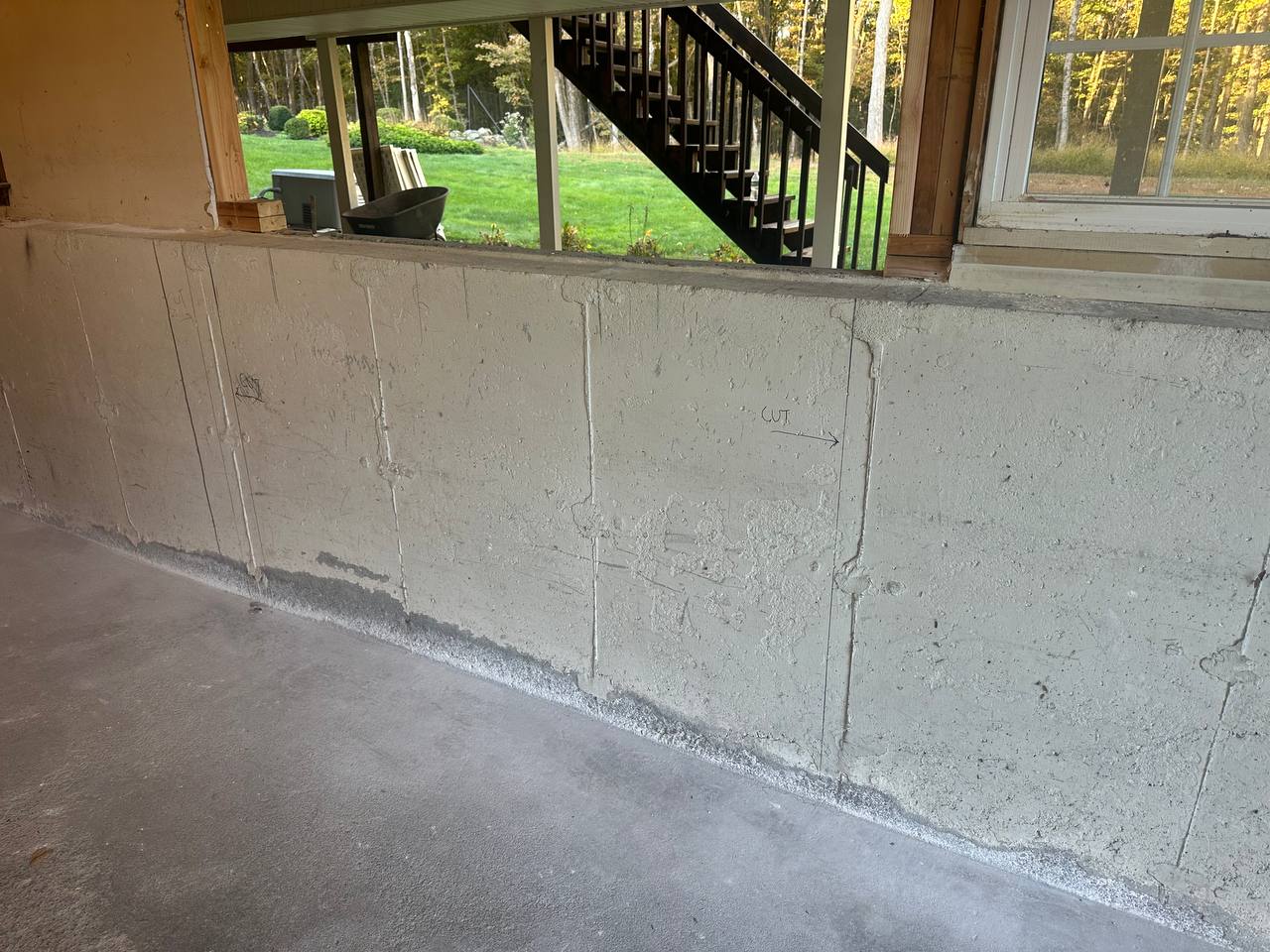 Concrete wall marked and prepared for precision structural cutting