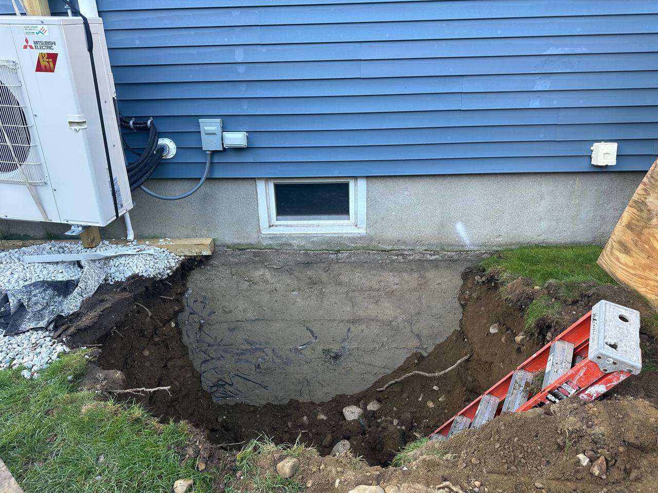Foundation excavation and preparation for egress window cutting project